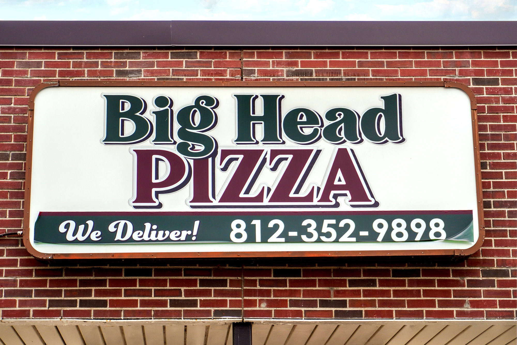 Big Head Pizza Sign
